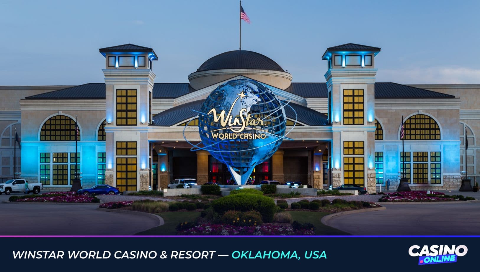 Exterior view of WinStar World Casino & Resort in Oklahoma, USA, featuring the illuminated entrance and iconic globe sculpture at dusk.